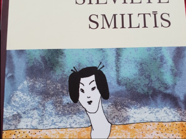 Sieviete smiltīs